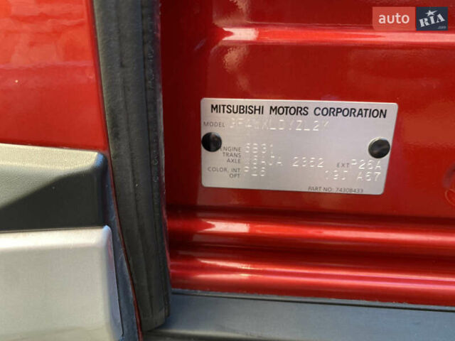 Красный Мицубиси Аутлендер, объемом двигателя 3 л и пробегом 106 тыс. км за 20700 $, фото 59 на Automoto.ua
