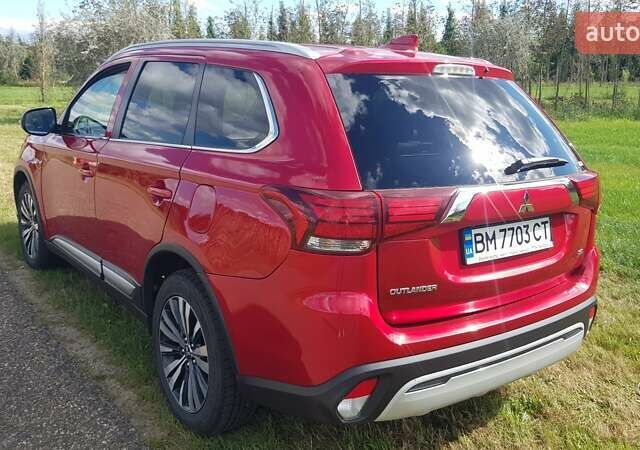 Красный Мицубиси Аутлендер, объемом двигателя 2.36 л и пробегом 70 тыс. км за 17950 $, фото 3 на Automoto.ua