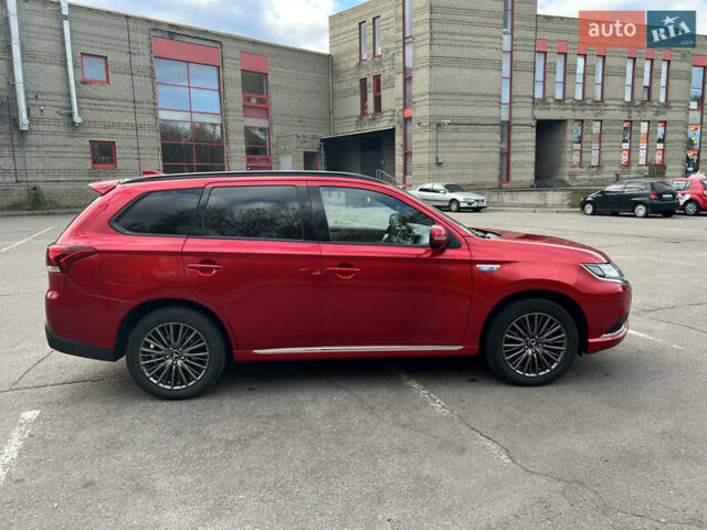 Красный Мицубиси Аутлендер, объемом двигателя 2.36 л и пробегом 94 тыс. км за 26000 $, фото 6 на Automoto.ua