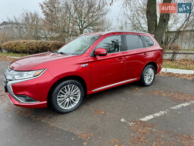 Красный Мицубиси Аутлендер, объемом двигателя 2.36 л и пробегом 65 тыс. км за 23800 $, фото 1 на Automoto.ua