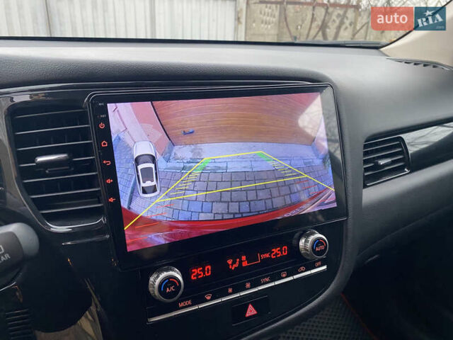 Красный Мицубиси Аутлендер, объемом двигателя 2 л и пробегом 40 тыс. км за 23500 $, фото 23 на Automoto.ua