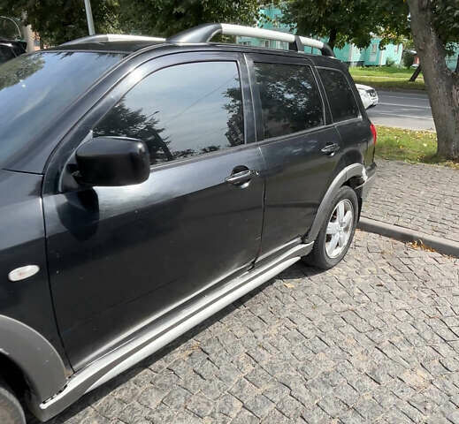 Мицубиси Аутлендер, объемом двигателя 2.4 л и пробегом 250 тыс. км за 4600 $, фото 1 на Automoto.ua