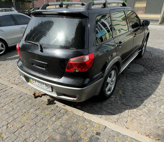 Мицубиси Аутлендер, объемом двигателя 2.4 л и пробегом 300 тыс. км за 3999 $, фото 3 на Automoto.ua