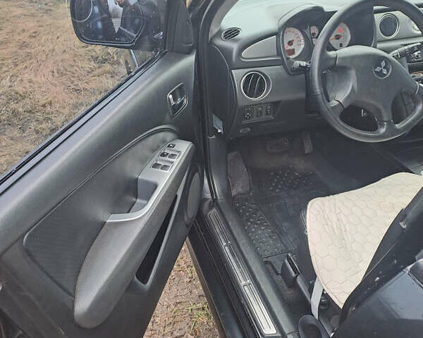 Мицубиси Аутлендер, объемом двигателя 2.4 л и пробегом 210 тыс. км за 6200 $, фото 7 на Automoto.ua