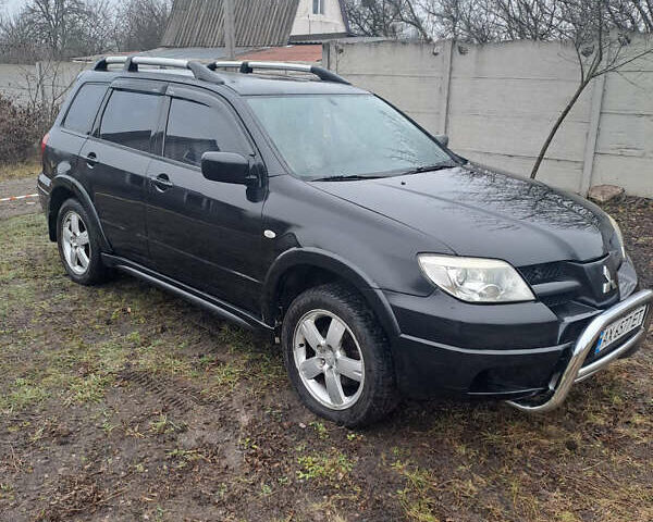 Мицубиси Аутлендер, объемом двигателя 2.4 л и пробегом 210 тыс. км за 6200 $, фото 3 на Automoto.ua