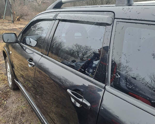 Мицубиси Аутлендер, объемом двигателя 2.4 л и пробегом 210 тыс. км за 6200 $, фото 5 на Automoto.ua