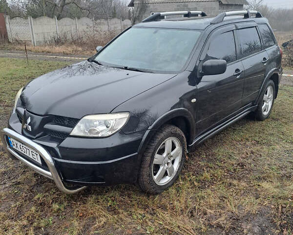 Мицубиси Аутлендер, объемом двигателя 2.4 л и пробегом 210 тыс. км за 6200 $, фото 1 на Automoto.ua