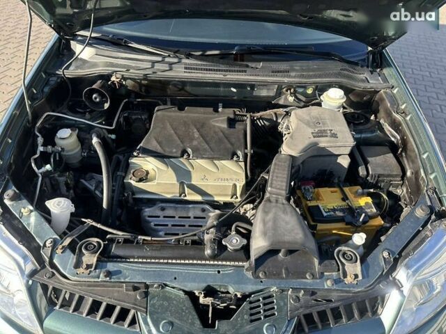 Мицубиси Аутлендер, объемом двигателя 2.4 л и пробегом 275 тыс. км за 7350 $, фото 21 на Automoto.ua