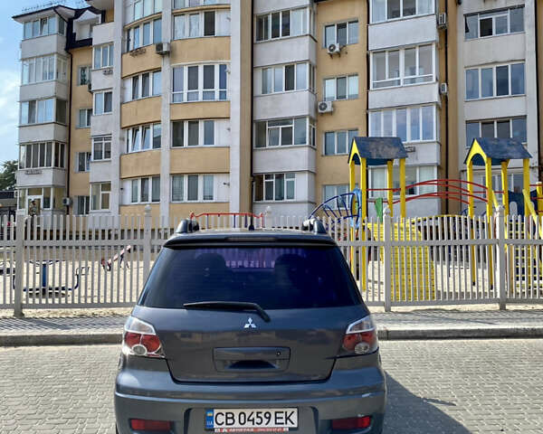 Мицубиси Аутлендер, объемом двигателя 2 л и пробегом 212 тыс. км за 6900 $, фото 2 на Automoto.ua