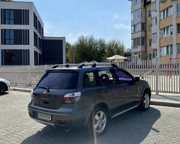 Мицубиси Аутлендер, объемом двигателя 2 л и пробегом 212 тыс. км за 6900 $, фото 3 на Automoto.ua
