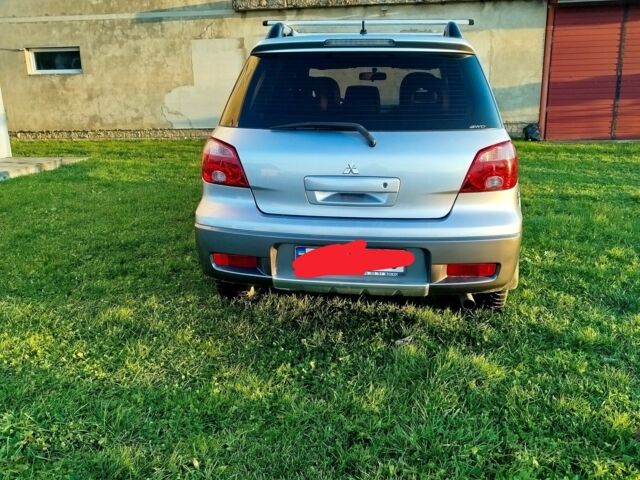 Серый Мицубиси Аутлендер, объемом двигателя 0 л и пробегом 245 тыс. км за 5300 $, фото 2 на Automoto.ua