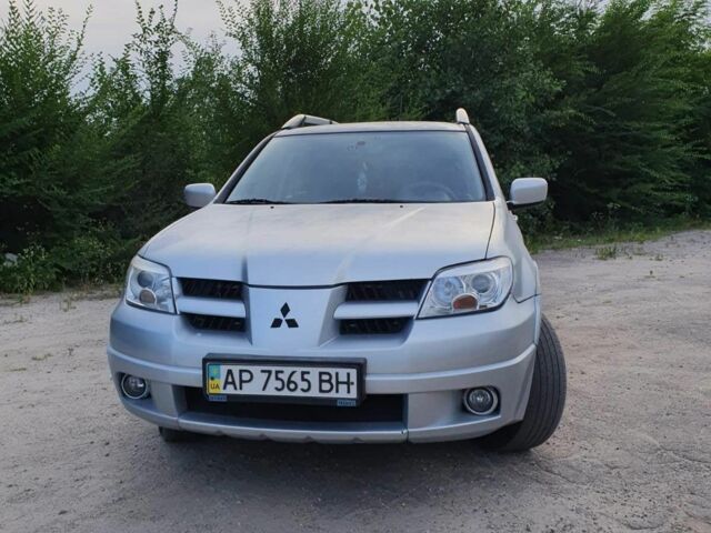 Сірий Міцубісі Аутлендер, об'ємом двигуна 2.4 л та пробігом 204 тис. км за 5600 $, фото 3 на Automoto.ua