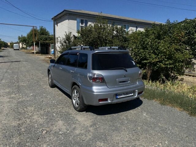 Серый Мицубиси Аутлендер, объемом двигателя 2.4 л и пробегом 291 тыс. км за 5999 $, фото 2 на Automoto.ua
