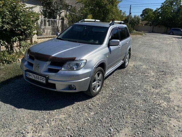 Серый Мицубиси Аутлендер, объемом двигателя 2.4 л и пробегом 291 тыс. км за 5999 $, фото 1 на Automoto.ua