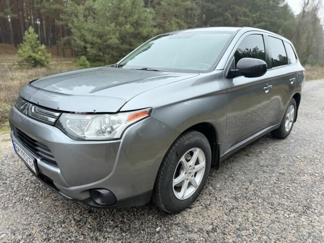 Серый Мицубиси Аутлендер, объемом двигателя 2.4 л и пробегом 150 тыс. км за 10900 $, фото 1 на Automoto.ua