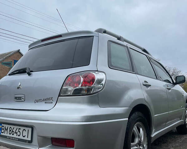 Сірий Міцубісі Аутлендер, об'ємом двигуна 2 л та пробігом 252 тис. км за 4600 $, фото 12 на Automoto.ua