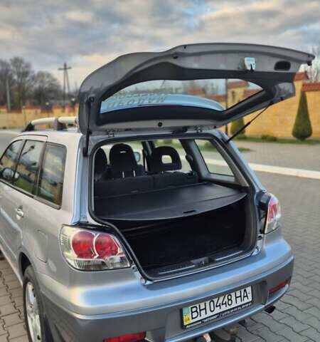 Серый Мицубиси Аутлендер, объемом двигателя 2 л и пробегом 209 тыс. км за 5800 $, фото 3 на Automoto.ua