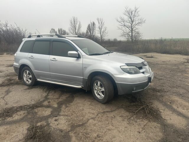 Сірий Міцубісі Аутлендер, об'ємом двигуна 2.4 л та пробігом 275 тис. км за 6400 $, фото 4 на Automoto.ua