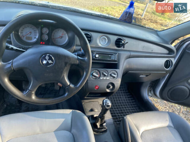 Серый Мицубиси Аутлендер, объемом двигателя 2 л и пробегом 250 тыс. км за 5700 $, фото 8 на Automoto.ua