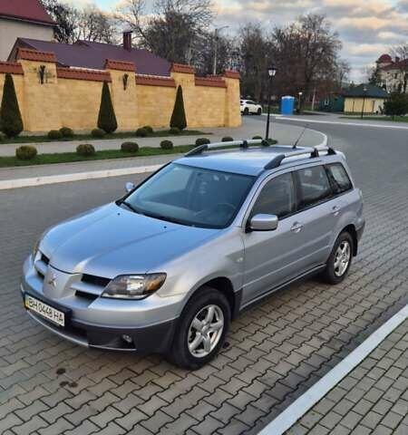 Серый Мицубиси Аутлендер, объемом двигателя 2 л и пробегом 209 тыс. км за 5800 $, фото 1 на Automoto.ua