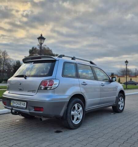 Серый Мицубиси Аутлендер, объемом двигателя 2 л и пробегом 209 тыс. км за 5800 $, фото 2 на Automoto.ua