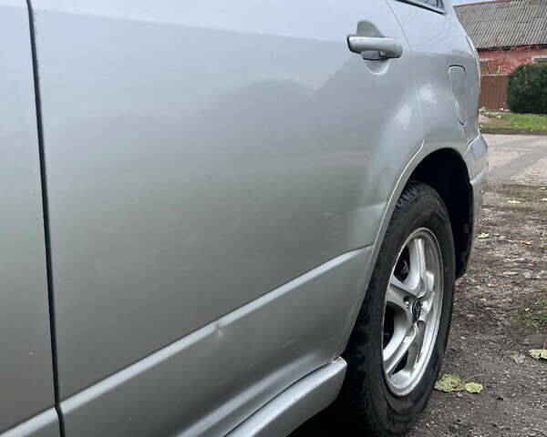 Сірий Міцубісі Аутлендер, об'ємом двигуна 2 л та пробігом 252 тис. км за 4600 $, фото 29 на Automoto.ua