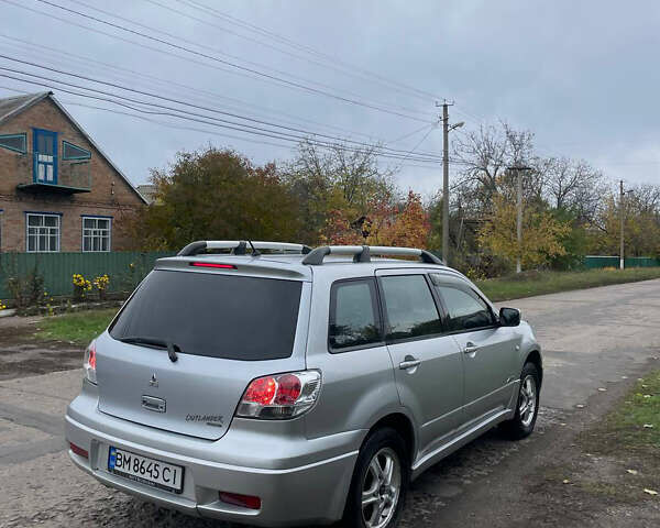 Сірий Міцубісі Аутлендер, об'ємом двигуна 2 л та пробігом 252 тис. км за 4600 $, фото 2 на Automoto.ua
