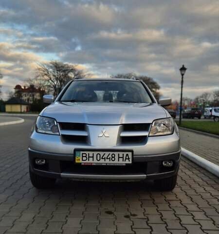 Серый Мицубиси Аутлендер, объемом двигателя 2 л и пробегом 209 тыс. км за 5800 $, фото 4 на Automoto.ua