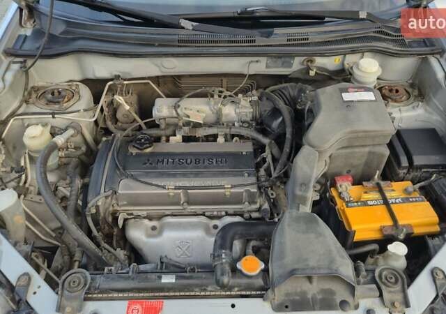 Серый Мицубиси Аутлендер, объемом двигателя 2 л и пробегом 209 тыс. км за 5800 $, фото 11 на Automoto.ua