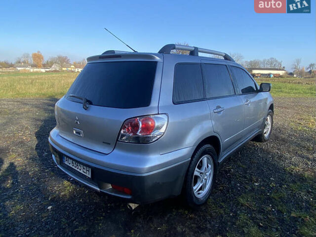 Серый Мицубиси Аутлендер, объемом двигателя 2 л и пробегом 250 тыс. км за 5700 $, фото 3 на Automoto.ua