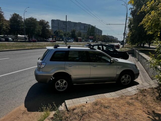 Сірий Міцубісі Аутлендер, об'ємом двигуна 2.4 л та пробігом 285 тис. км за 4400 $, фото 5 на Automoto.ua