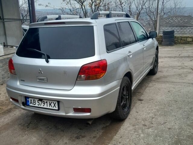 Серый Мицубиси Аутлендер, объемом двигателя 2.4 л и пробегом 250 тыс. км за 5600 $, фото 1 на Automoto.ua