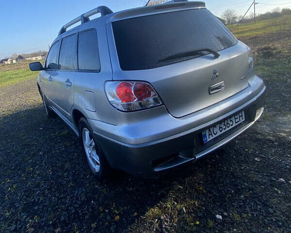 Серый Мицубиси Аутлендер, объемом двигателя 2 л и пробегом 250 тыс. км за 5700 $, фото 2 на Automoto.ua