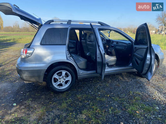 Серый Мицубиси Аутлендер, объемом двигателя 2 л и пробегом 250 тыс. км за 5700 $, фото 16 на Automoto.ua
