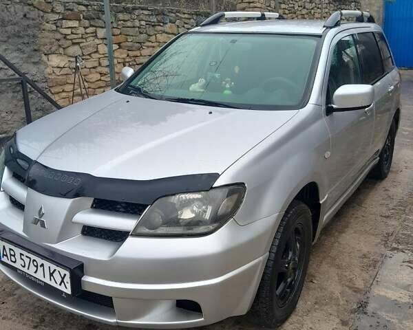 Серый Мицубиси Аутлендер, объемом двигателя 2.4 л и пробегом 250 тыс. км за 5600 $, фото 6 на Automoto.ua