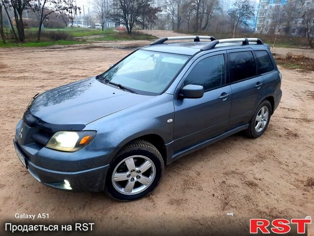 Серый Мицубиси Аутлендер, объемом двигателя 2 л и пробегом 388 тыс. км за 4500 $, фото 8 на Automoto.ua