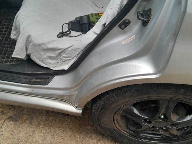 Серый Мицубиси Аутлендер, объемом двигателя 2.4 л и пробегом 250 тыс. км за 5600 $, фото 6 на Automoto.ua