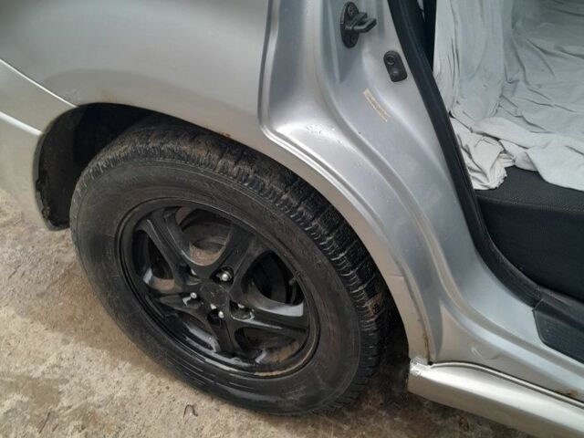 Серый Мицубиси Аутлендер, объемом двигателя 2.4 л и пробегом 250 тыс. км за 5600 $, фото 4 на Automoto.ua