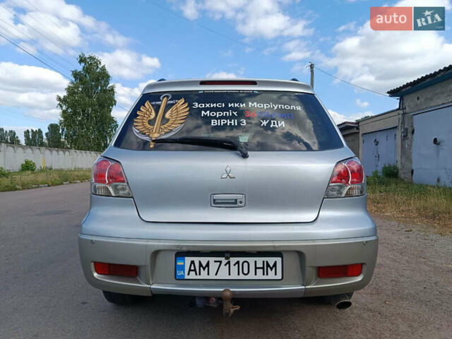 Серый Мицубиси Аутлендер, объемом двигателя 2 л и пробегом 443 тыс. км за 6200 $, фото 7 на Automoto.ua