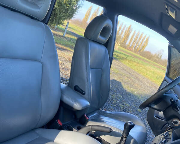 Серый Мицубиси Аутлендер, объемом двигателя 2 л и пробегом 250 тыс. км за 5700 $, фото 11 на Automoto.ua