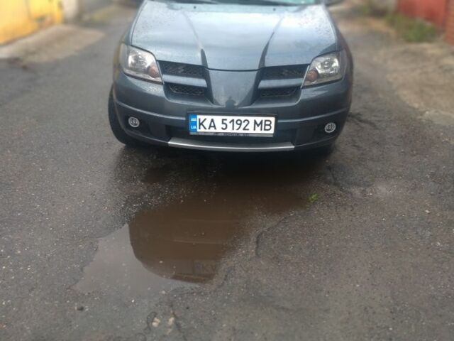 Серый Мицубиси Аутлендер, объемом двигателя 2.4 л и пробегом 286 тыс. км за 7400 $, фото 1 на Automoto.ua