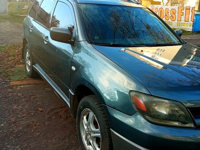 Серый Мицубиси Аутлендер, объемом двигателя 2.4 л и пробегом 204 тыс. км за 5600 $, фото 1 на Automoto.ua