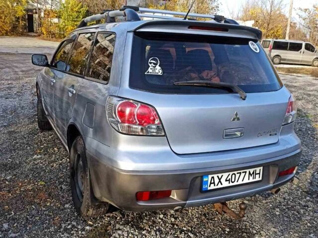Серый Мицубиси Аутлендер, объемом двигателя 2.4 л и пробегом 317 тыс. км за 5200 $, фото 3 на Automoto.ua