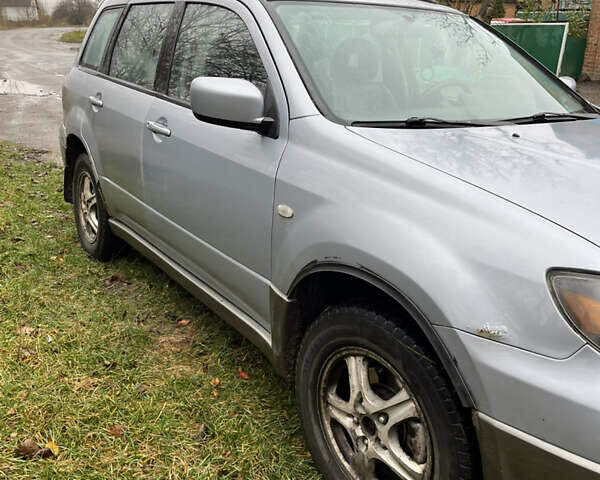 Серый Мицубиси Аутлендер, объемом двигателя 2.38 л и пробегом 432 тыс. км за 4700 $, фото 10 на Automoto.ua