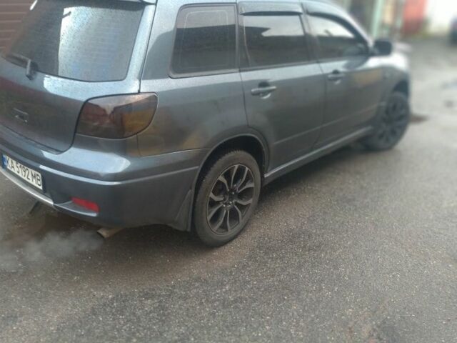 Серый Мицубиси Аутлендер, объемом двигателя 2.4 л и пробегом 286 тыс. км за 7400 $, фото 2 на Automoto.ua