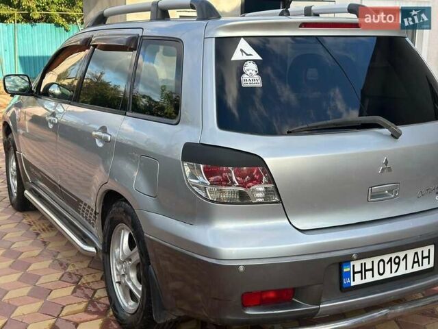 Сірий Міцубісі Аутлендер, об'ємом двигуна 2.4 л та пробігом 161 тис. км за 7500 $, фото 6 на Automoto.ua
