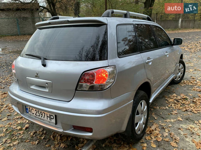 Серый Мицубиси Аутлендер, объемом двигателя 2 л и пробегом 239 тыс. км за 5800 $, фото 7 на Automoto.ua