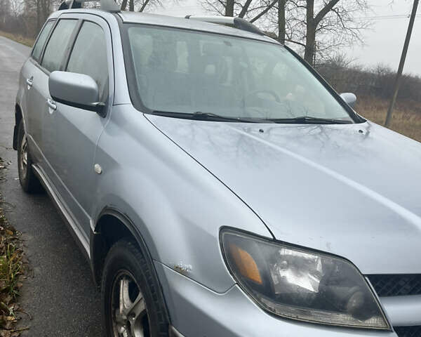 Серый Мицубиси Аутлендер, объемом двигателя 2.38 л и пробегом 432 тыс. км за 4700 $, фото 4 на Automoto.ua