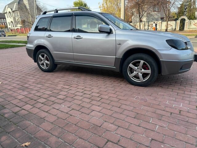 Серый Мицубиси Аутлендер, объемом двигателя 2.4 л и пробегом 221 тыс. км за 5550 $, фото 4 на Automoto.ua