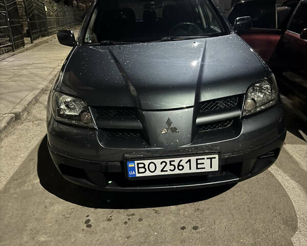 Сірий Міцубісі Аутлендер, об'ємом двигуна 2 л та пробігом 259 тис. км за 5100 $, фото 1 на Automoto.ua